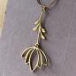 Preview: moving blossom bud -  Pendant in Gold-Plated Stainless Steel on a Delicate Chain